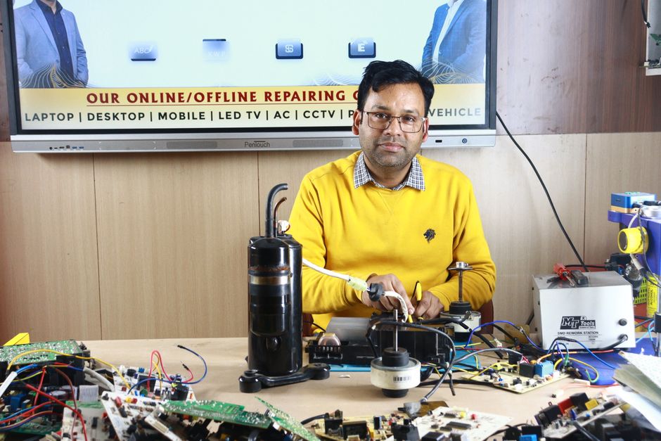 Technician performing AC installation with specialized tools